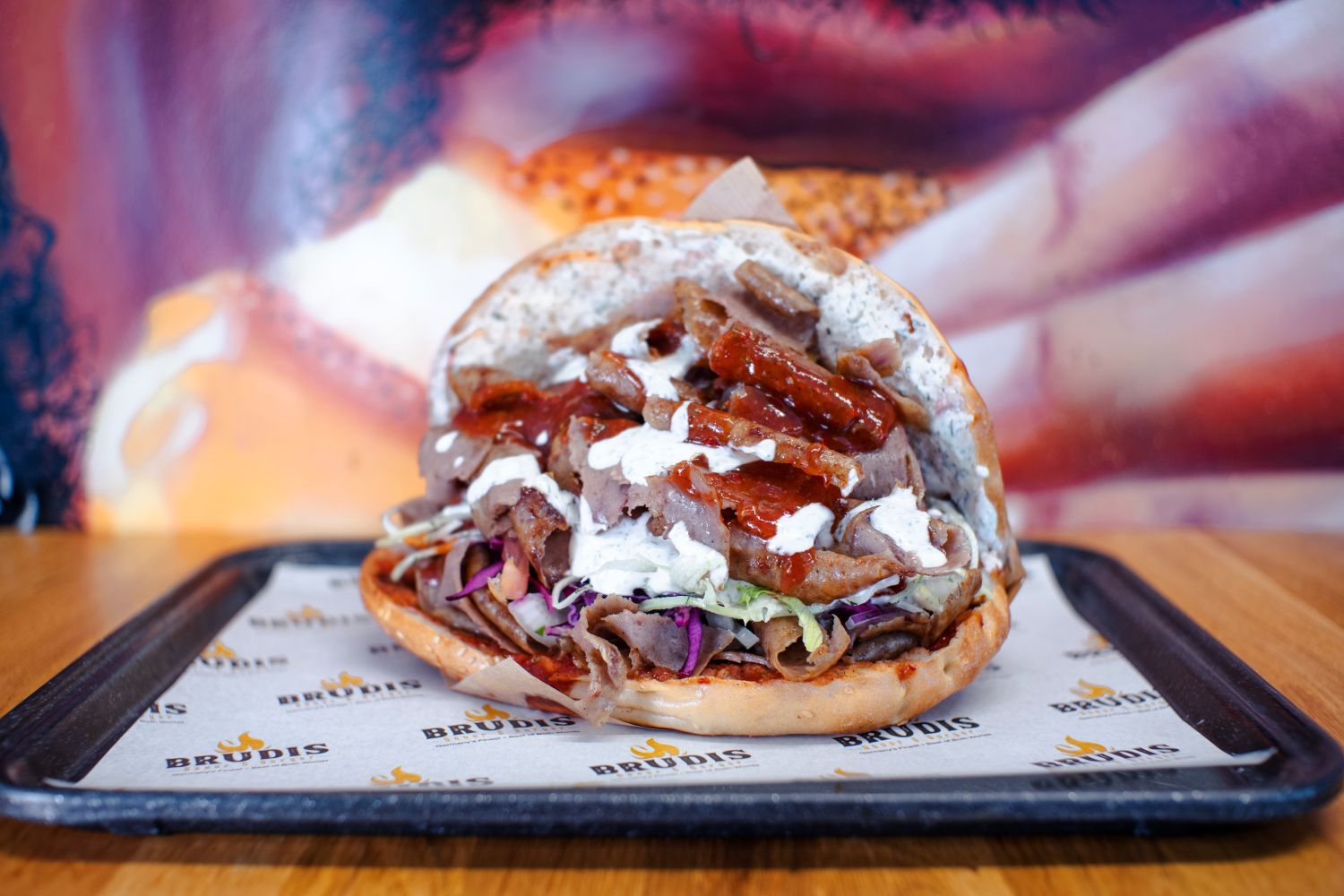 Brudis doner sandwich loaded with beef, salad and house sauces