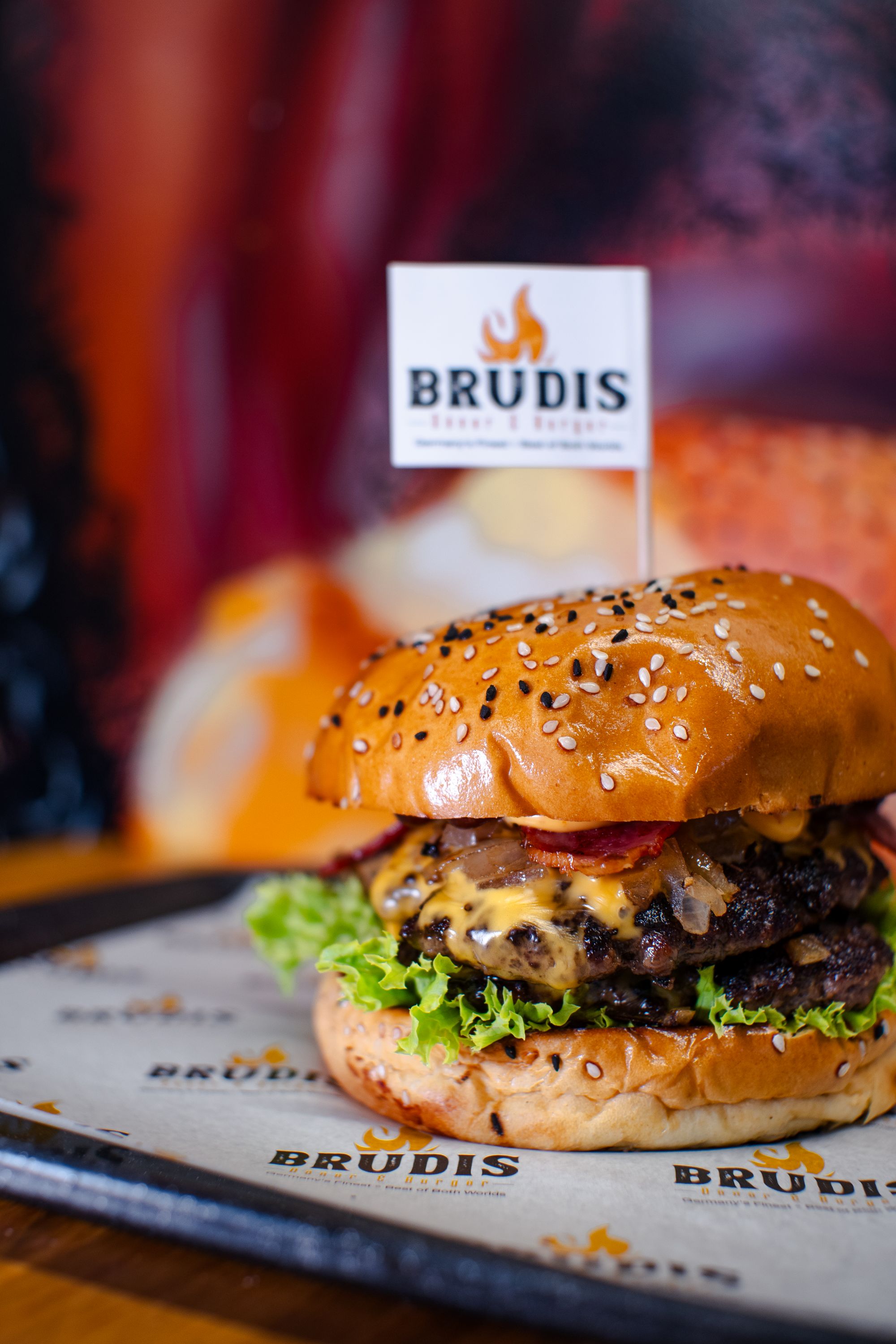 Brudis double smash burger with melted cheese, bacon and crispy onions
